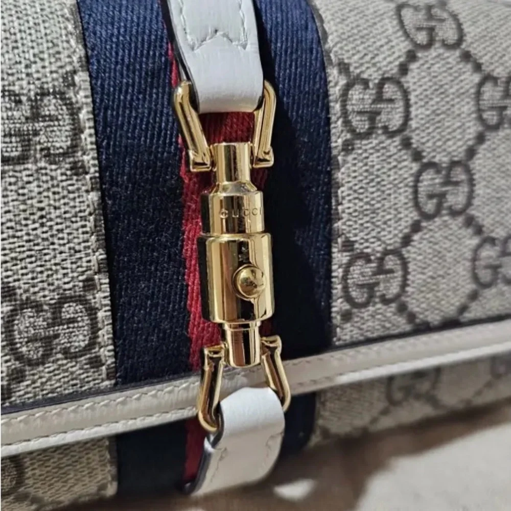 Gucci Beige and Black Clutch with Gold Accents - Picture 2 of 5